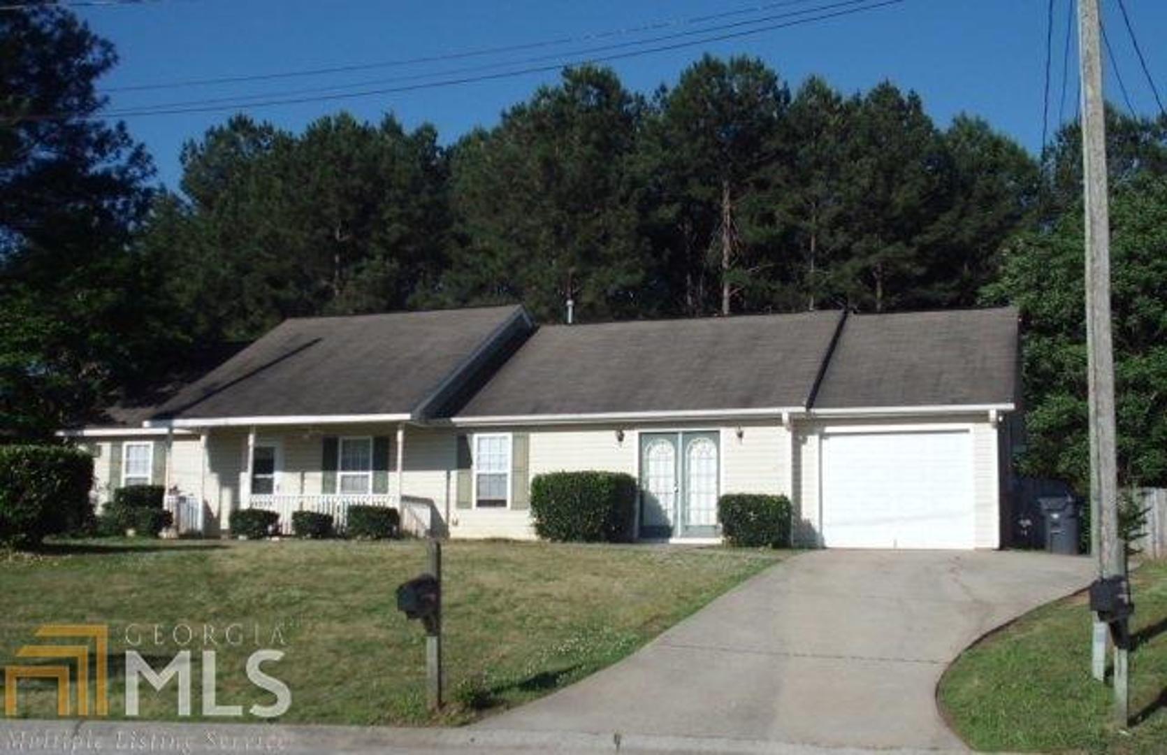 a house with trees in the background