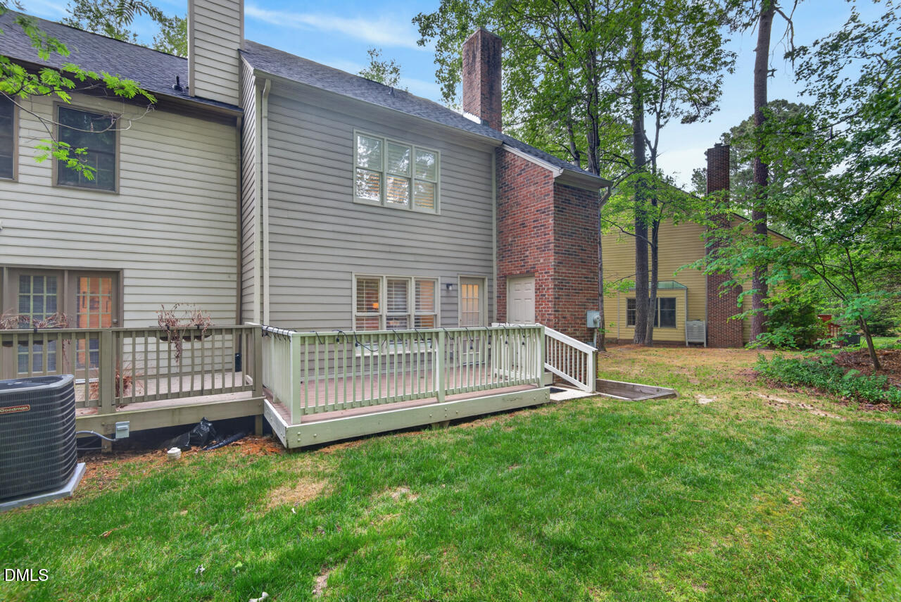 3307 Coachman's Way Durham, NC 27705 - Photo 45 of 50 a view of a house with a yard and a garden