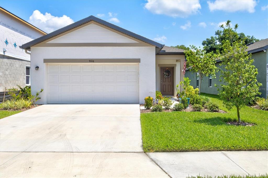 9016 Waxwing Way Parrish, FL 34219 - Photo 1 of 1 a front view of a house with a yard