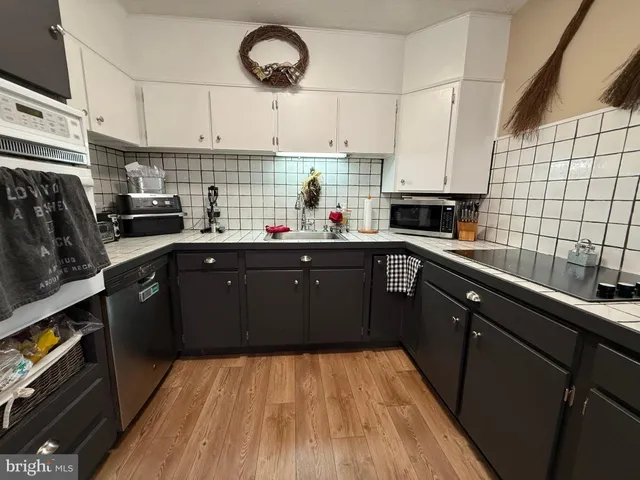 a view of gym equipment and car parked