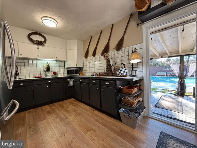a bathroom with a double vanity sink mirror and toilet