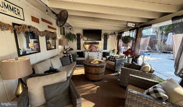 a bedroom with a bed and a tv