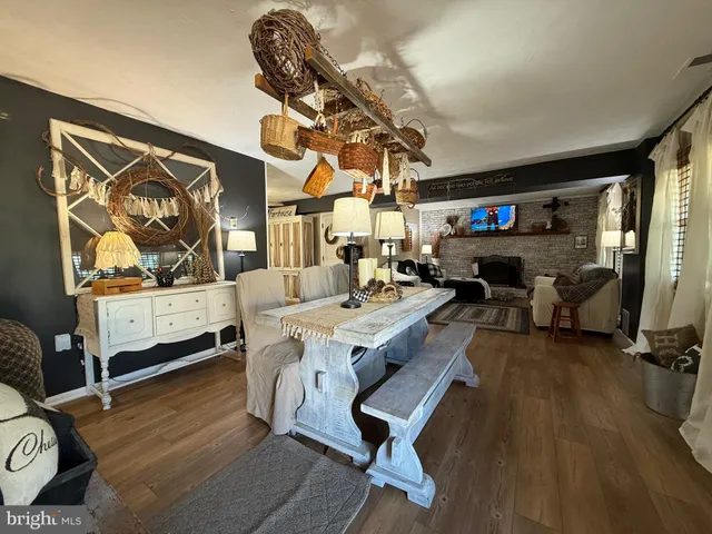 a kitchen with kitchen island granite countertop a sink appliances cabinets and counter space