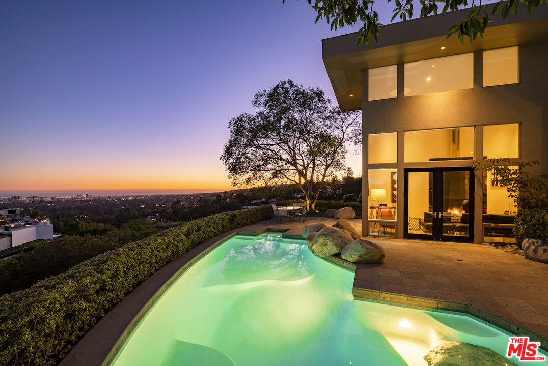 a view of a swimming pool with a patio