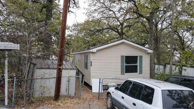 a view of a house with a sink and backyard