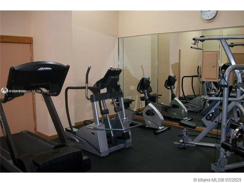 6345 Collins Avenue, Unit PH21 Miami Beach, FL 33141 - Photo 8 of 8 a view of a room with gym equipment