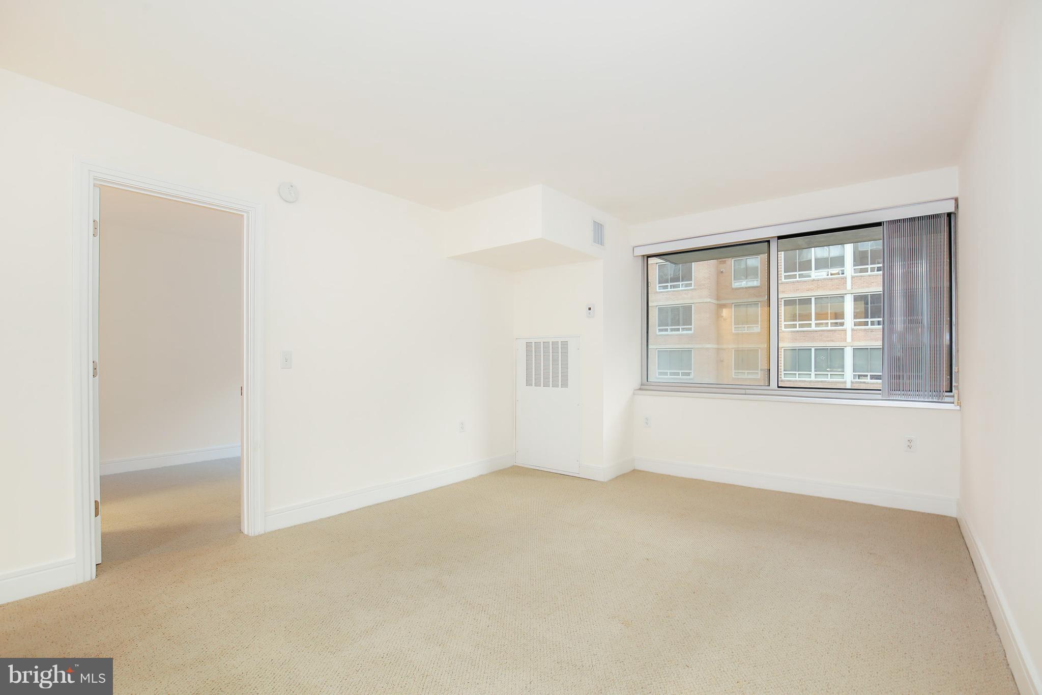 800 4th Street Southwest, Unit S113 Washington, DC 20024 - Photo 11 of 22 an empty room with windows