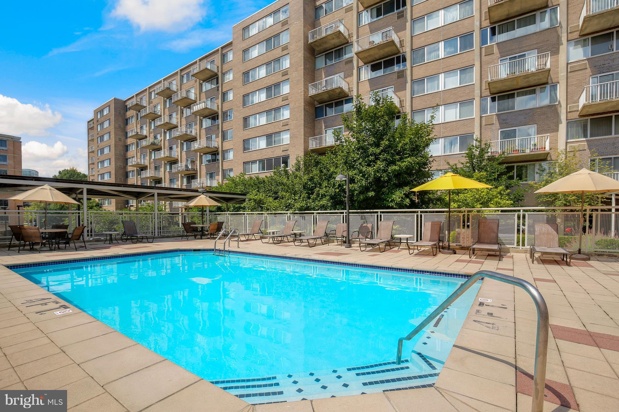 800 4th Street Southwest, Unit S113 Washington, DC 20024 - Photo 22 of 22 a view of a swimming pool with a lounge chairs