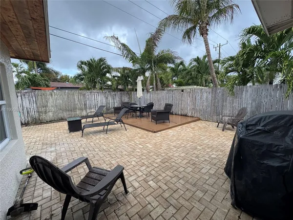 a view of a backyard and a patio