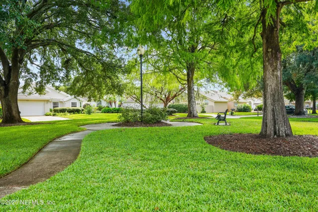 an aerial view of a houses with a lake view