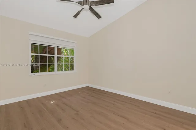 a view of a room with wooden floor and closet