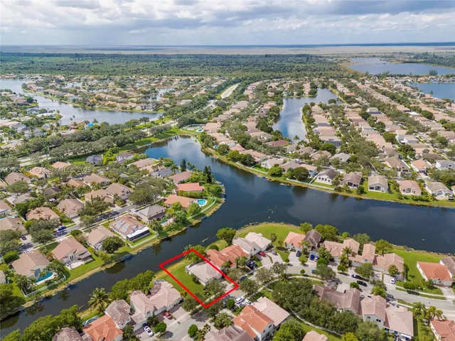 an aerial view of residential houses with outdoor space