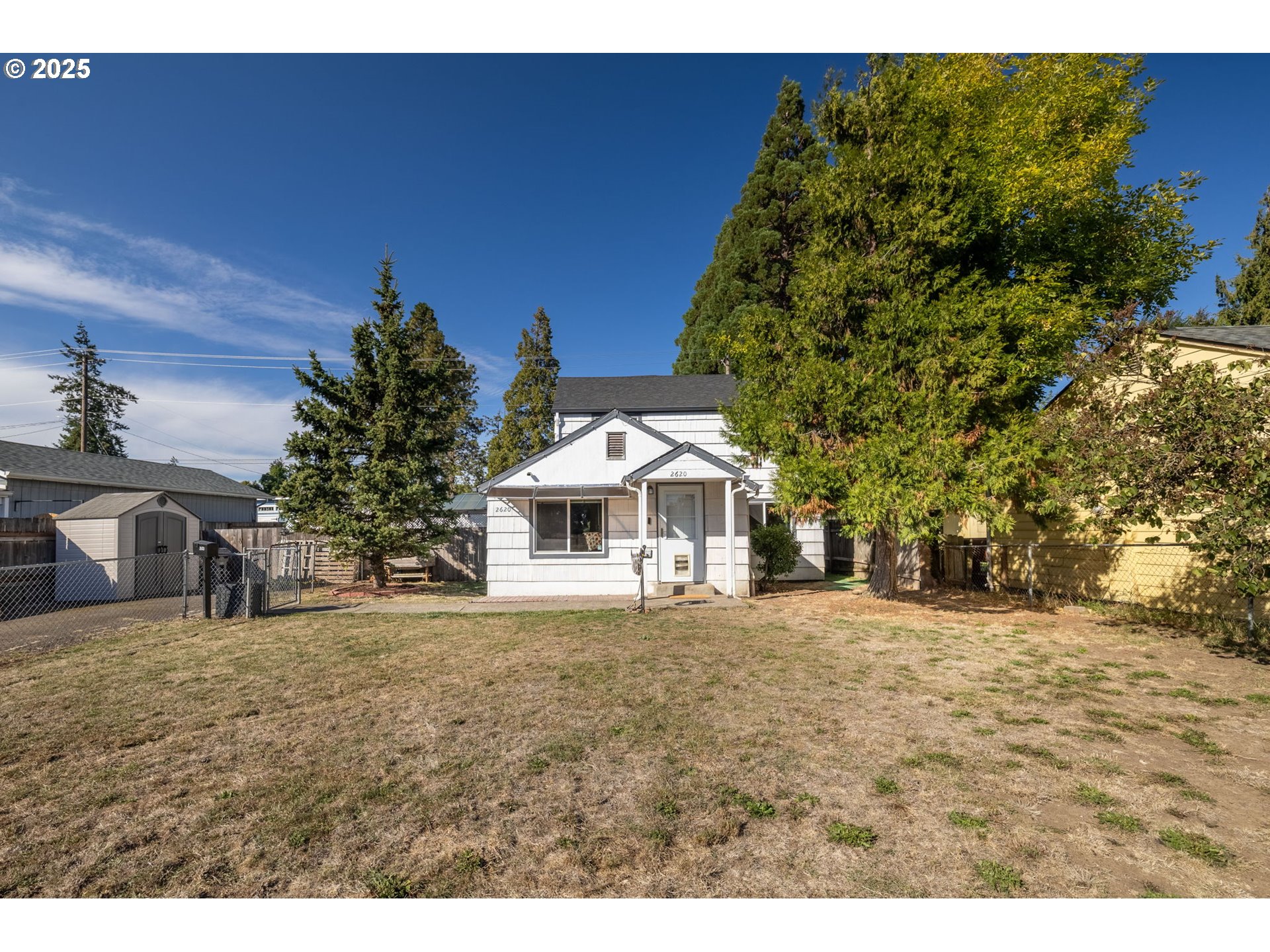 2620 E Street Springfield, OR 97477 - Photo 2 of 45 a front view of a house with a garden
