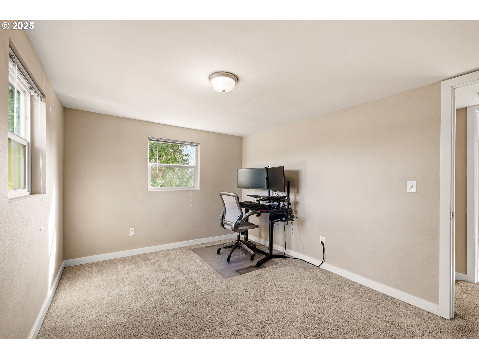 2620 E Street Springfield, OR 97477 - Photo 30 of 45 a view of a workspace with furniture and a window