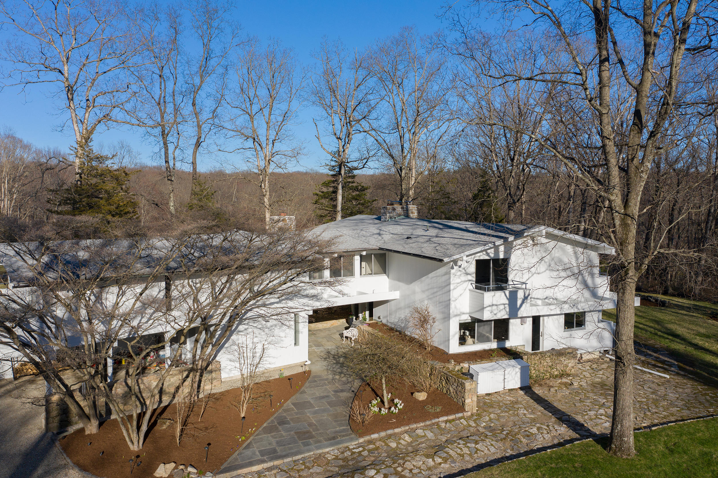 46 Benedict Hill Road New Canaan, CT 06840 - Photo 26 of 50 a view of a house with a yard