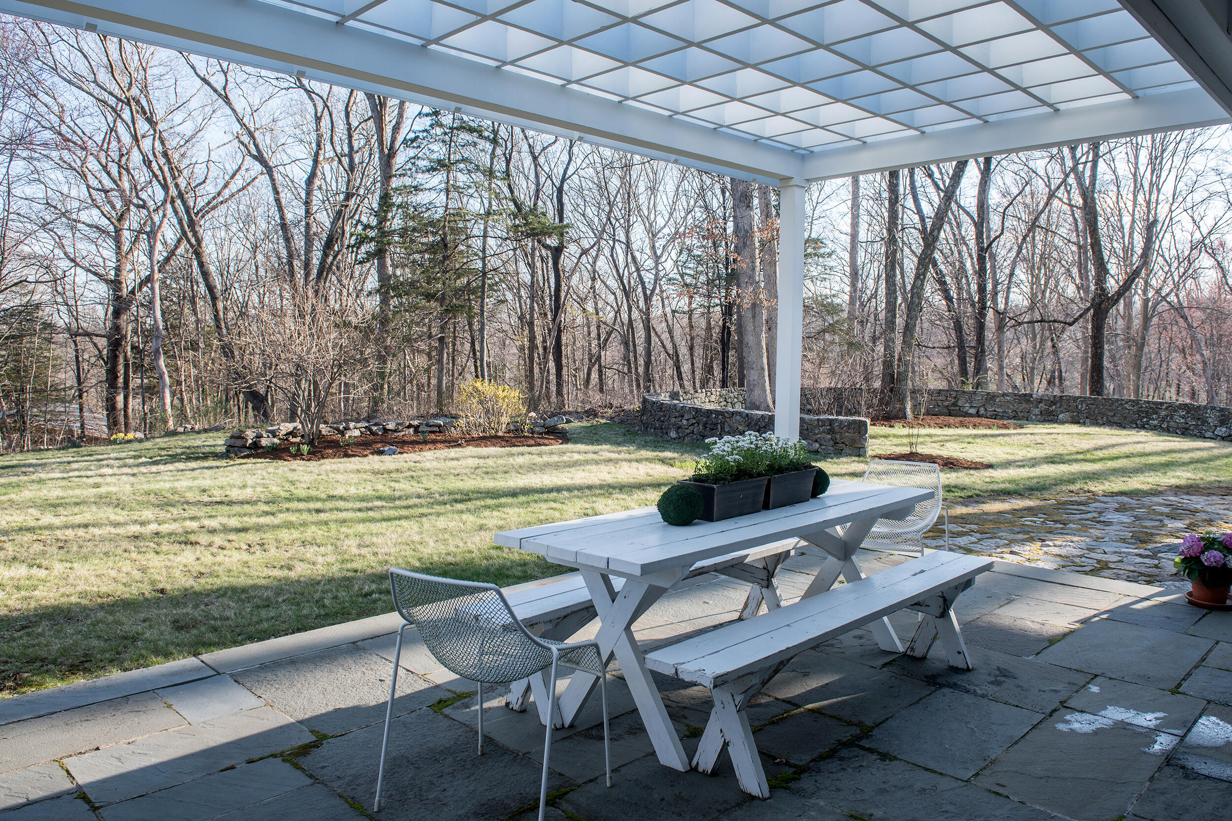 46 Benedict Hill Road New Canaan, CT 06840 - Photo 42 of 50 a view of a swimming pool with lawn chairs and large trees