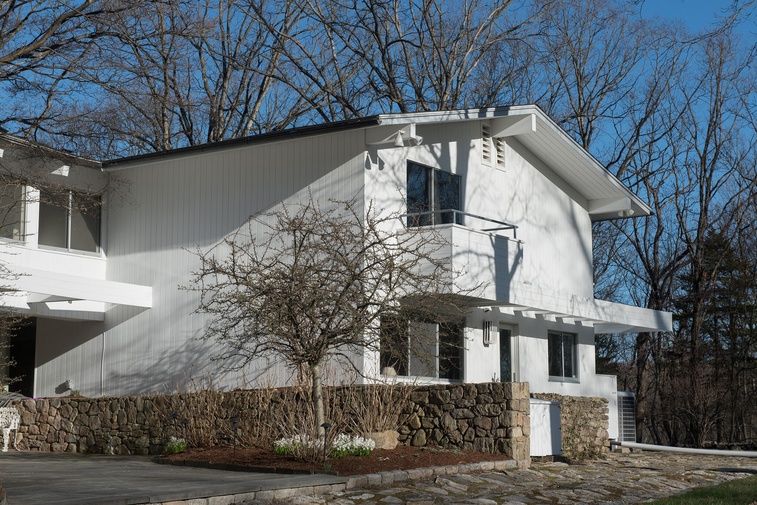 46 Benedict Hill Road New Canaan, CT 06840 - Photo 46 of 50 a view of a white house with a large tree