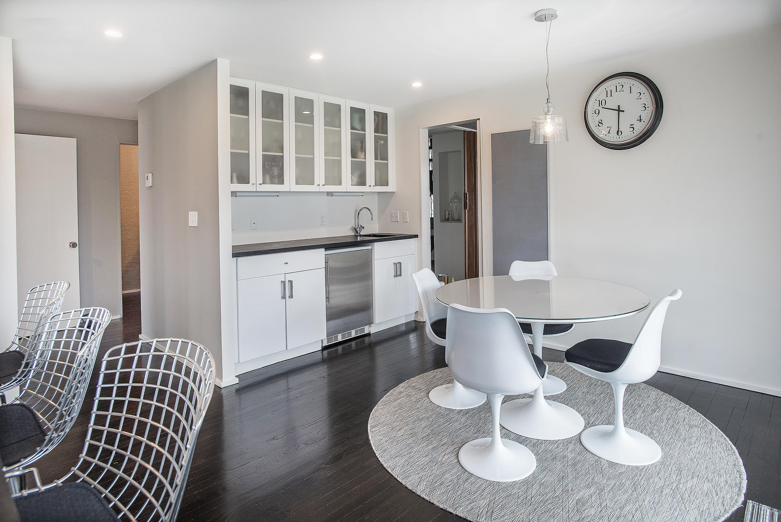 46 Benedict Hill Road New Canaan, CT 06840 - Photo 8 of 50 a kitchen with stainless steel appliances granite countertop a dining table and chairs