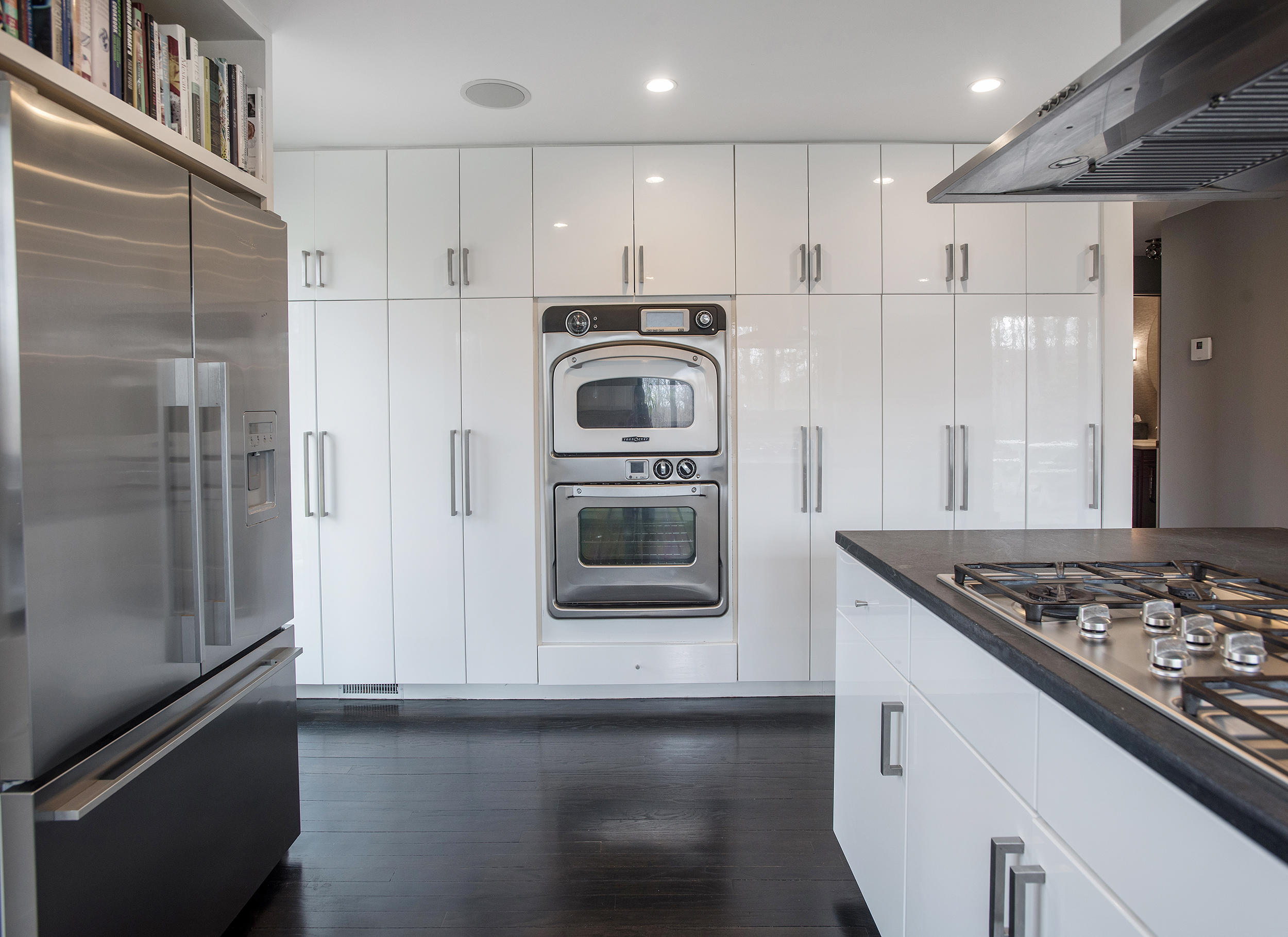 46 Benedict Hill Road New Canaan, CT 06840 - Photo 10 of 50 a kitchen with stainless steel appliances granite countertop a stove and a refrigerator
