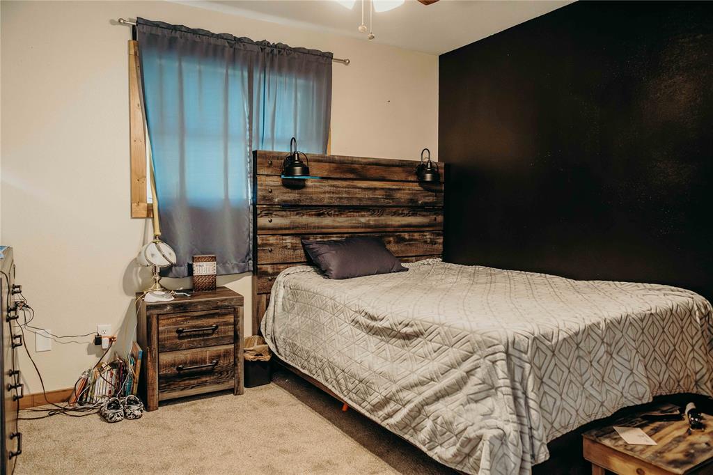 1740 Highway 2247 Comanche, TX 76442 - Photo 24 of 36 a bedroom with a bed and a tv