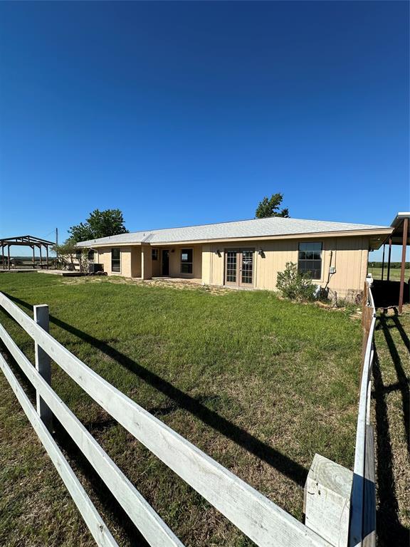 1740 Highway 2247 Comanche, TX 76442 - Photo 3 of 36 a front view of a house with a garden