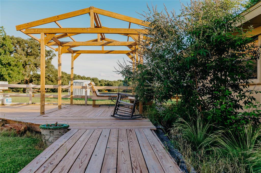 1740 Highway 2247 Comanche, TX 76442 - Photo 36 of 36 a view of a roof deck with chair and wooden floor