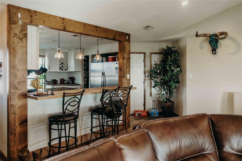 1740 Highway 2247 Comanche, TX 76442 - Photo 10 of 36 a view of living room kitchen and patio