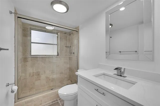 a view of a living room and floor to ceiling window or couch