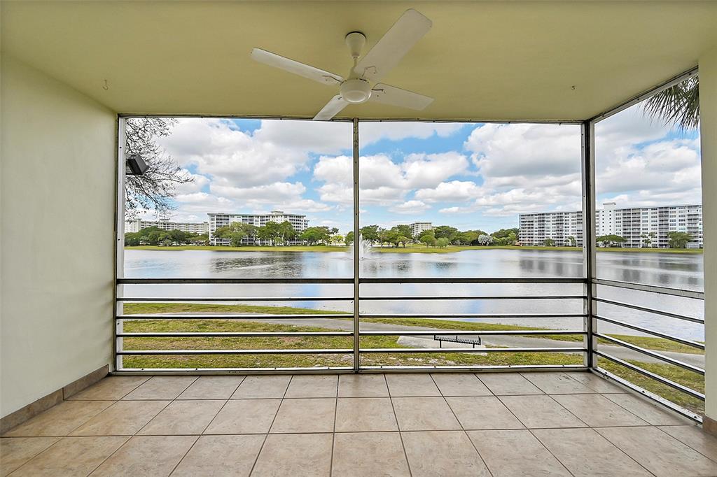 2801 North Palm Aire Drive, Unit 201 Pompano Beach, FL 33069 - Photo 15 of 19 a view of a floor to ceiling window next to a yard