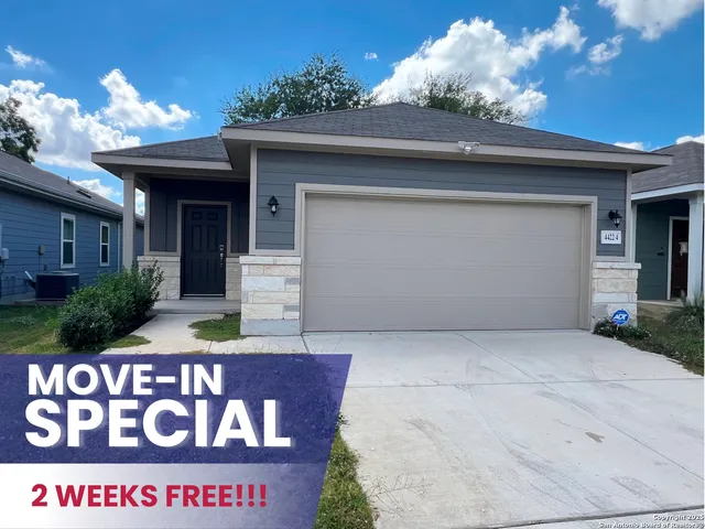 a front view of house with sign board