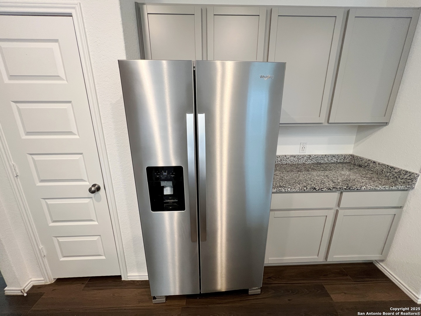 4422 Chandler Road, Unit 4 San Antonio, TX 78222 - Photo 13 of 31 a view of a refrigerator a microwave and cabinets