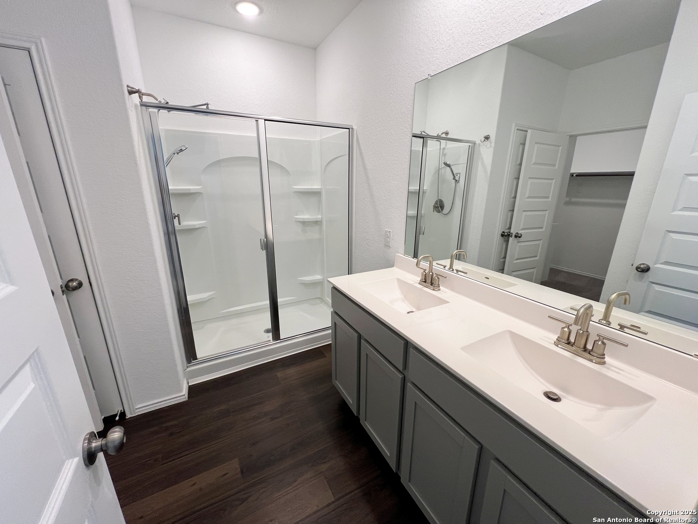 4422 Chandler Road, Unit 4 San Antonio, TX 78222 - Photo 25 of 31 a bathroom with a double vanity sink mirror and shower