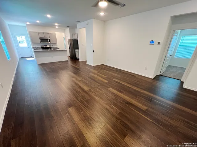 a view of a living room and wooden floor