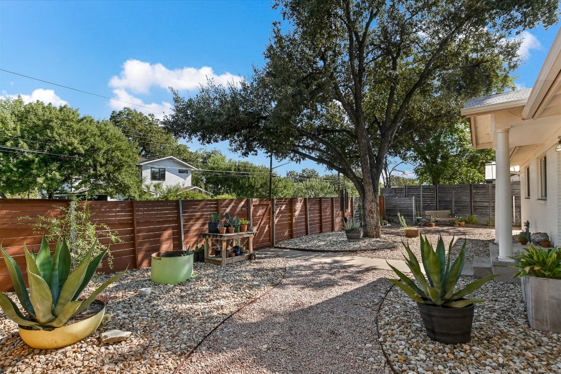 Fenced backyard featuring a patio
