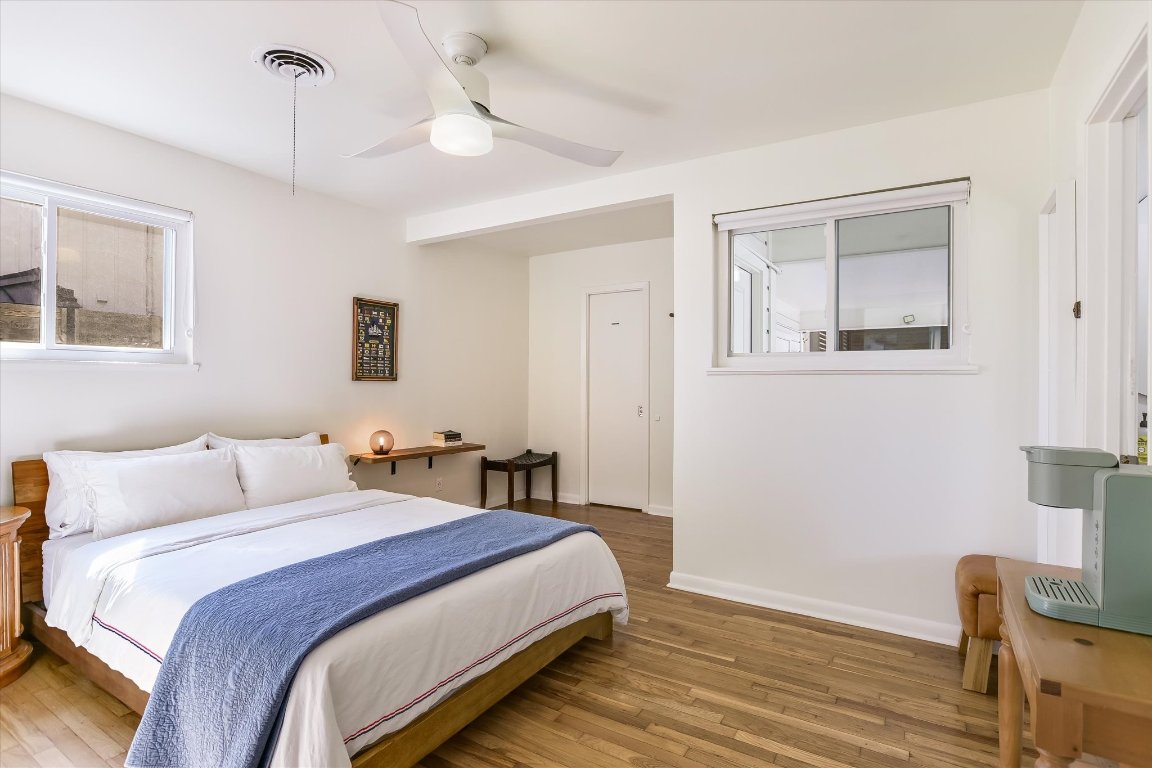 807 West Oltorf Street Austin, TX 78704 - Photo 11 of 22 Bedroom featuring wood-type flooring and a ceiling fan