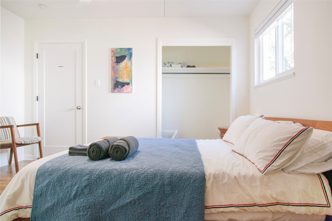 807 West Oltorf Street Austin, TX 78704 - Photo 14 of 22 Bedroom featuring wood finished floors and baseboards