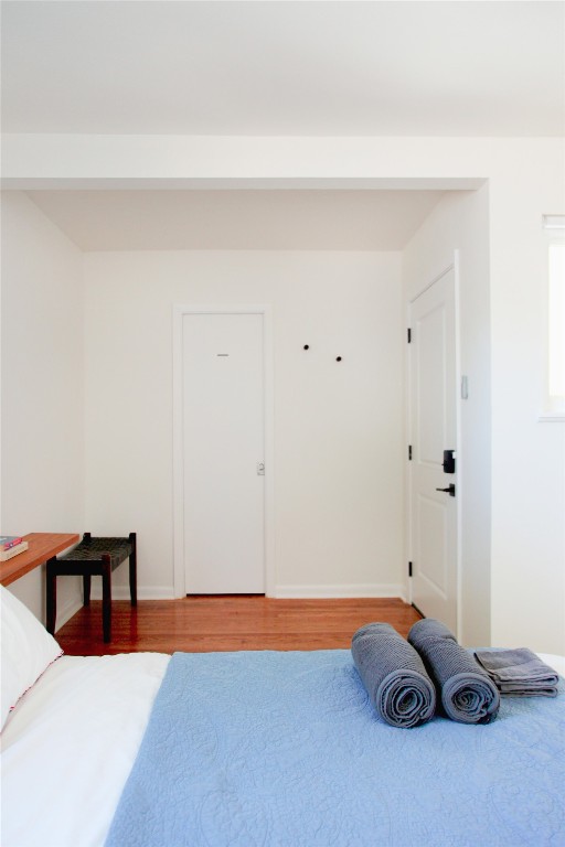 807 West Oltorf Street Austin, TX 78704 - Photo 15 of 22 Bedroom featuring wood finished floors and baseboards