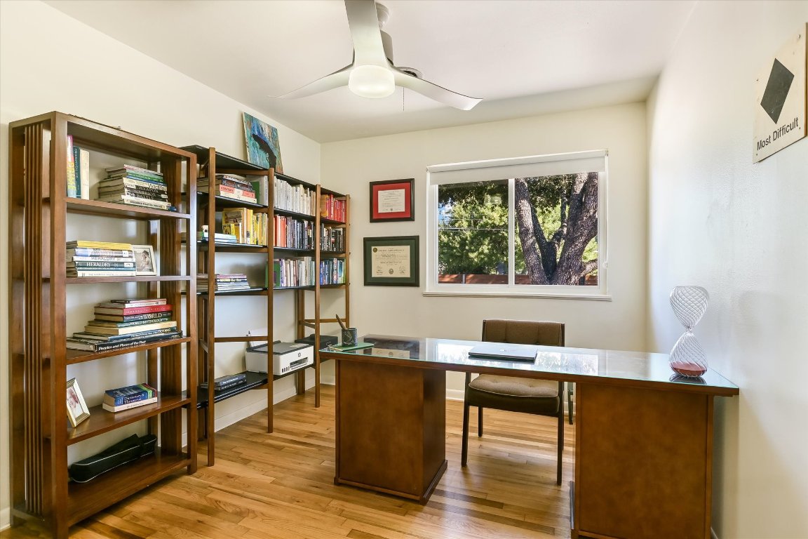 807 West Oltorf Street Austin, TX 78704 - Photo 16 of 22 Home office with light wood-style floors and a ceiling fan