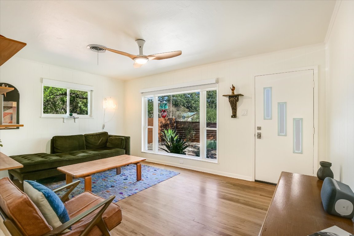 807 West Oltorf Street Austin, TX 78704 - Photo 3 of 22 Living room featuring wood finished floors, plenty of natural light, and ceiling fan