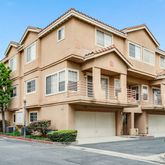 a view of a white building among the street