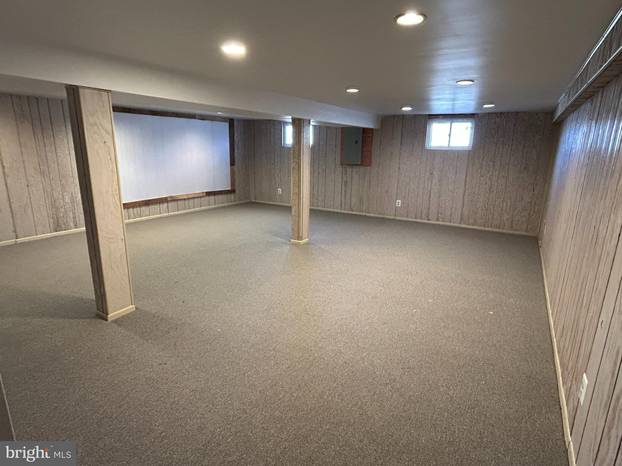 97 Sheppards Mill Road Bridgeton, NJ 08302 - Photo 20 of 27 an empty room with a projector and wooden floor