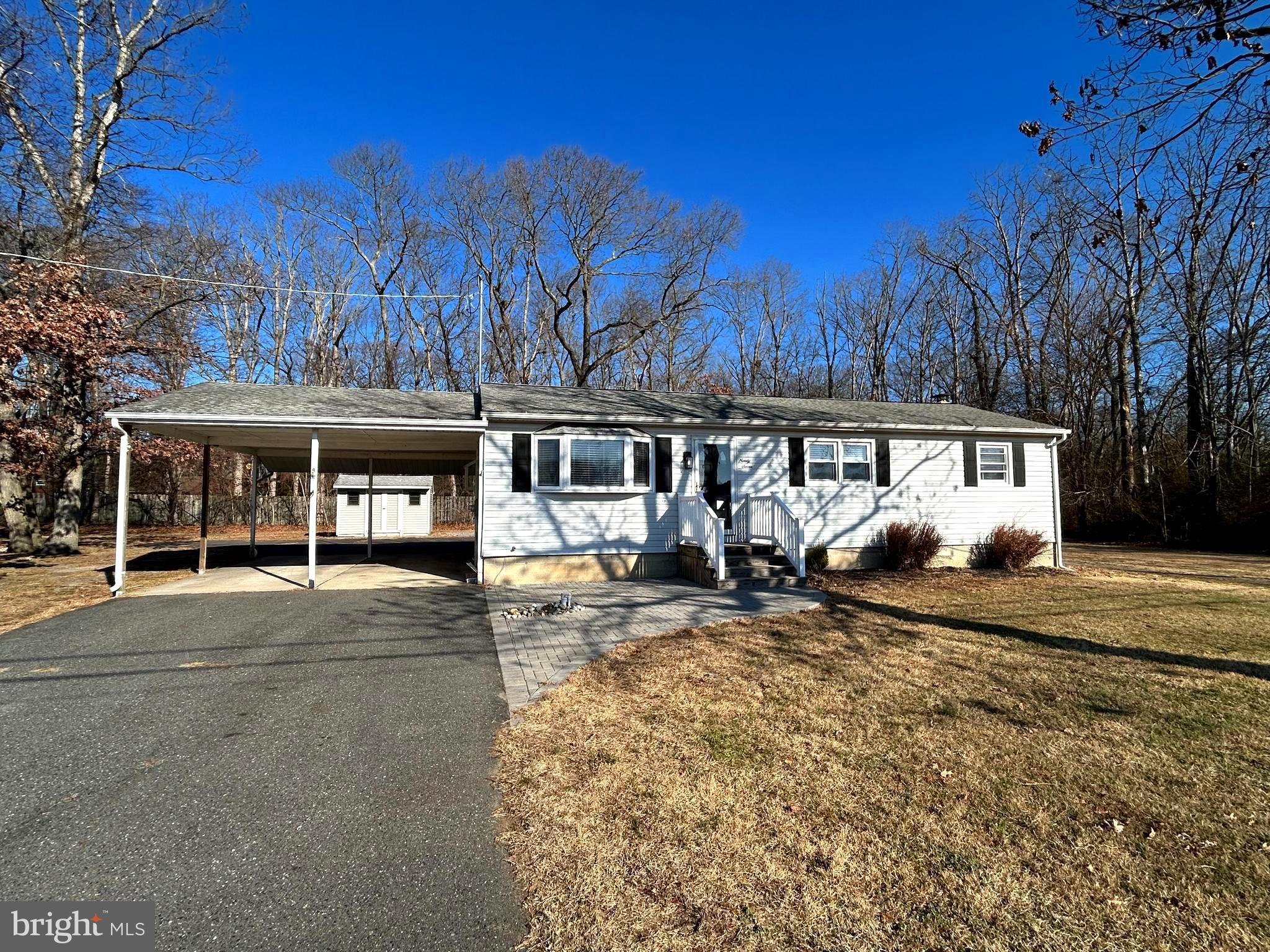 97 Sheppards Mill Road Bridgeton, NJ 08302 - Photo 2 of 27 a view of a house with a yard covered with snow in front of house