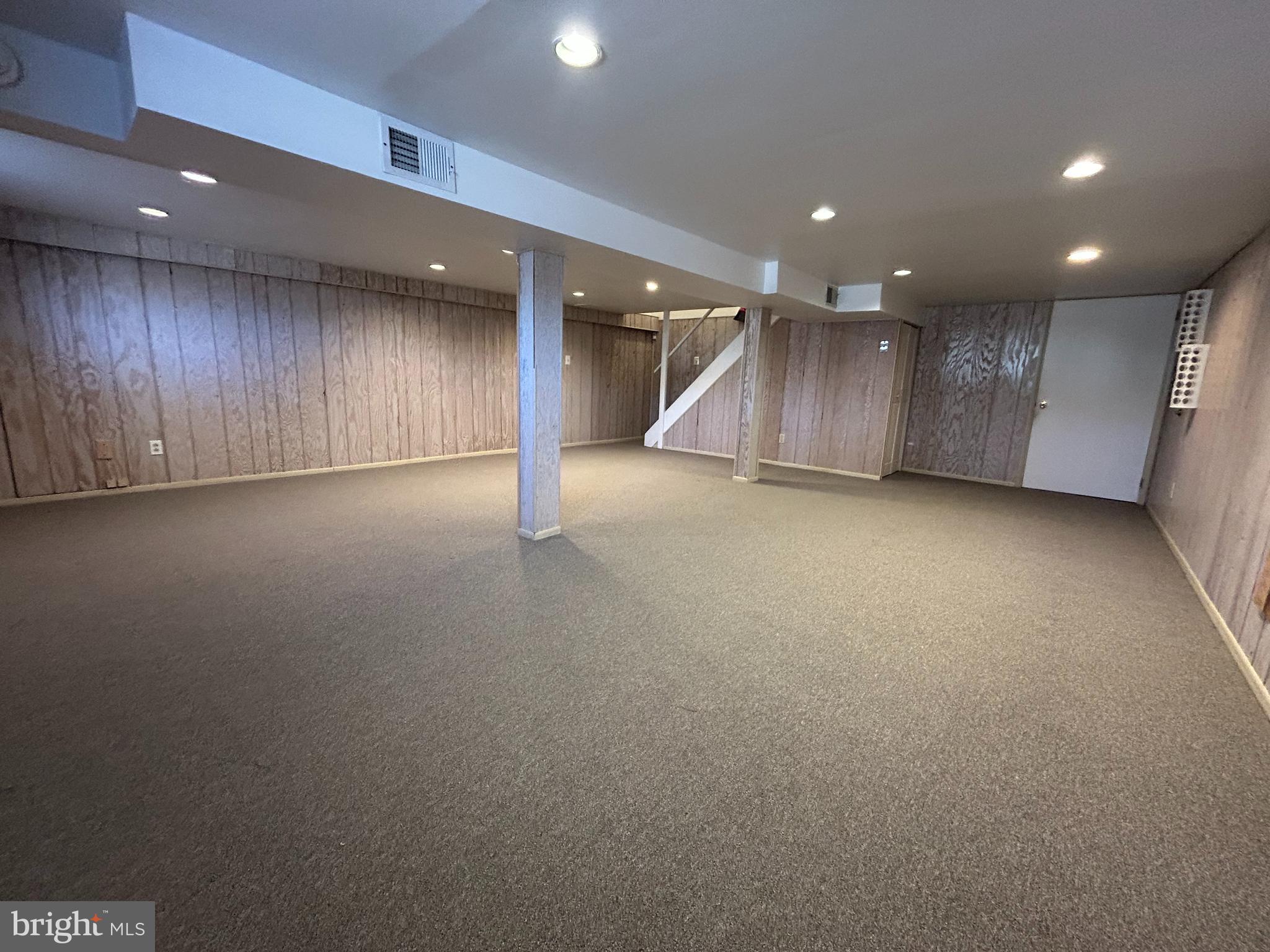 97 Sheppards Mill Road Bridgeton, NJ 08302 - Photo 21 of 27 an empty room with wooden floor and windows