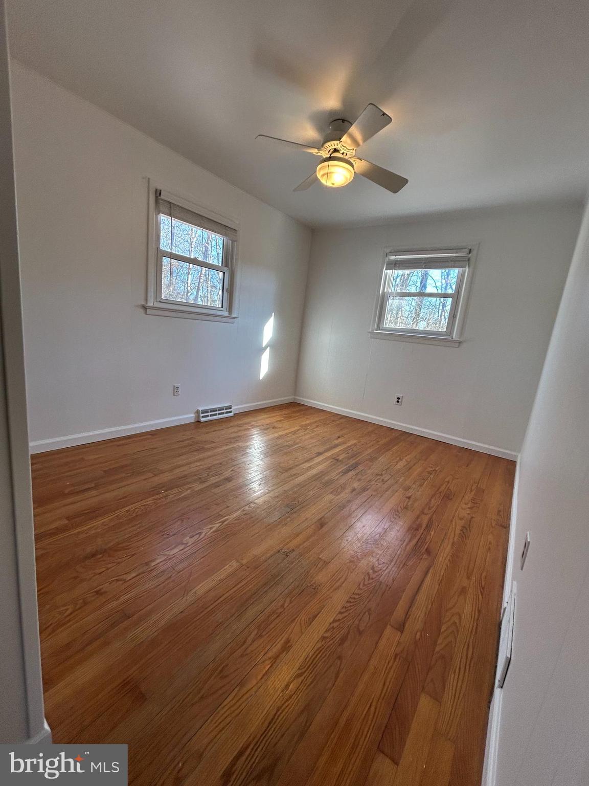 97 Sheppards Mill Road Bridgeton, NJ 08302 - Photo 26 of 27 a view of an empty room with wooden floor and a window