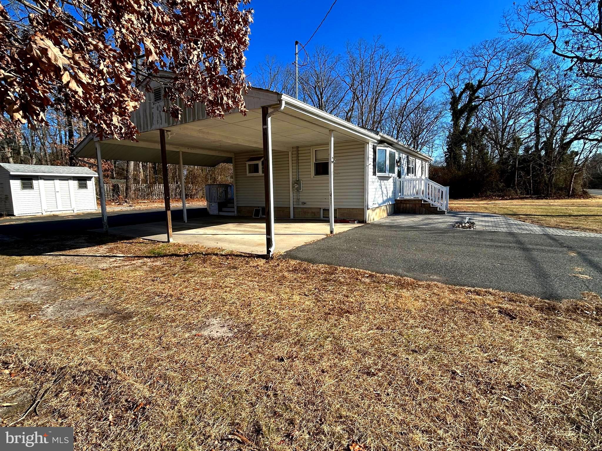 97 Sheppards Mill Road Bridgeton, NJ 08302 - Photo 5 of 27 a backyard of a house with a tree