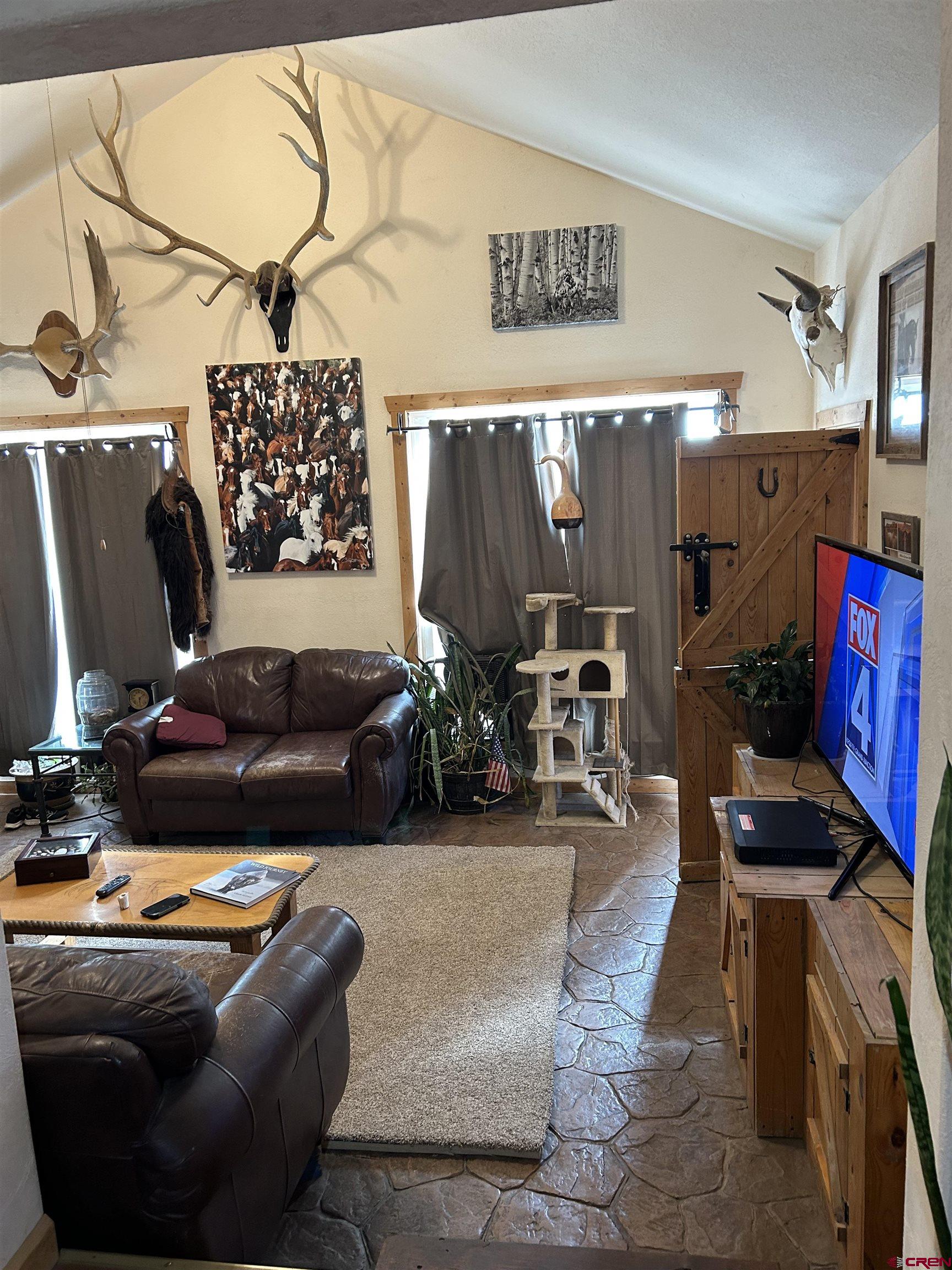 27701 BB Road Nucla, CO 81424 - Photo 27 of 29 a living room with furniture and wooden floor