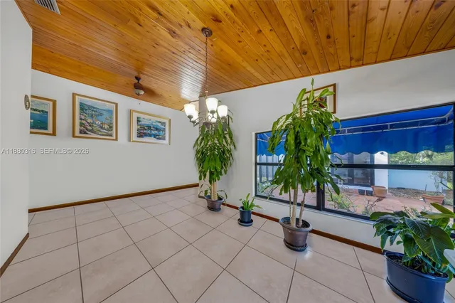 a view of a livingroom with furniture and a flat screen tv