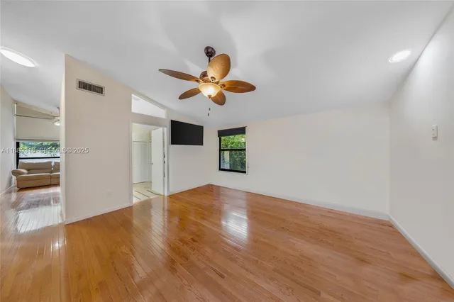 a view of an empty room with a flat screen tv