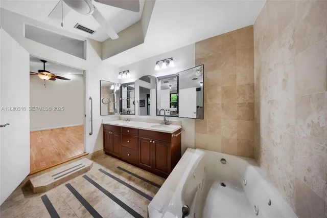 a bathroom with a bathtub and a sink