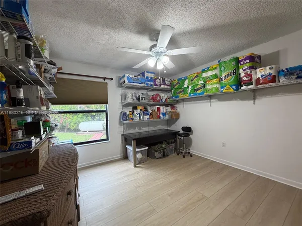 an aerial view of residential house with outdoor space and swimming pool